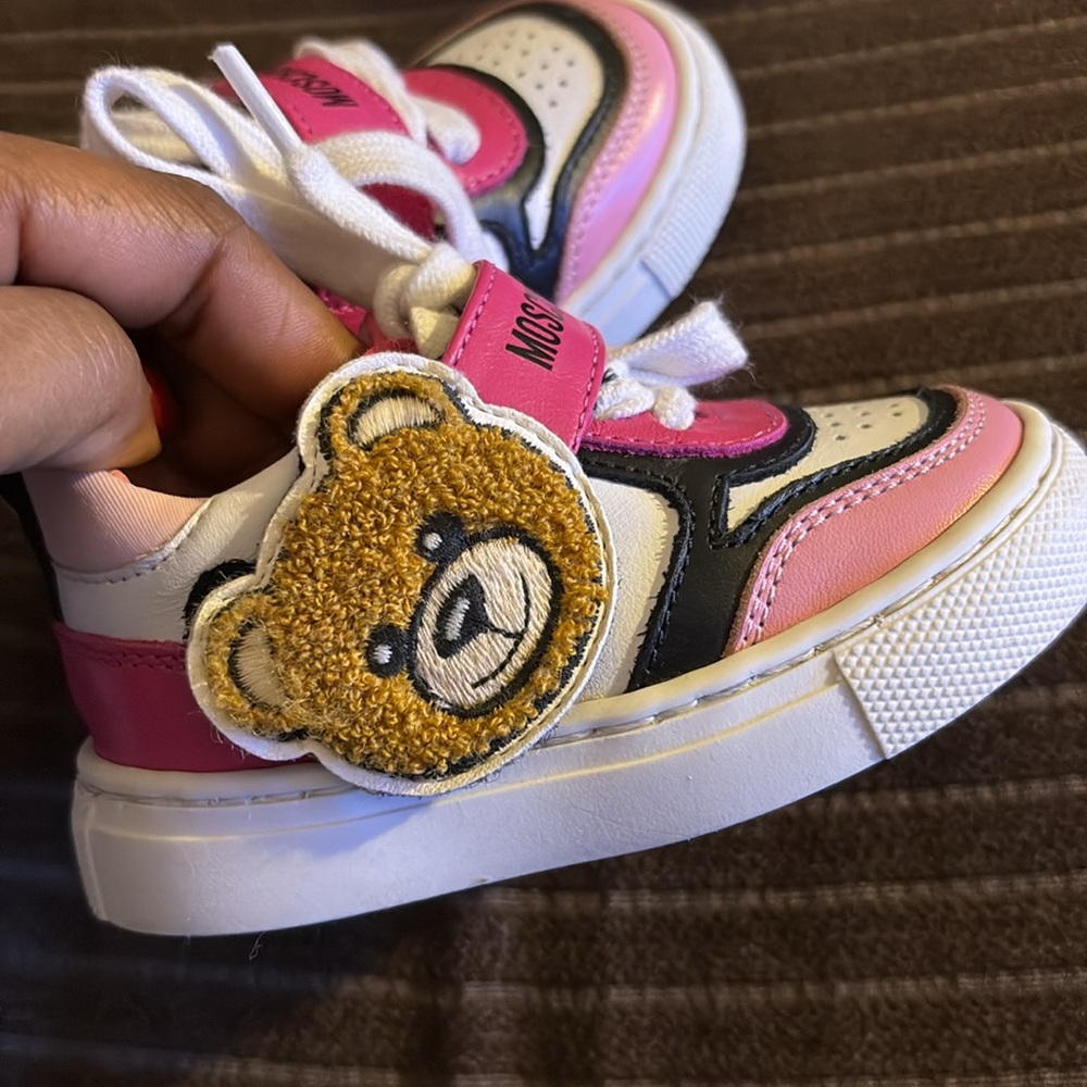 Moschino Baby Shoes Size 19 toddler 
They fit my baby at 4.5 size
Like New